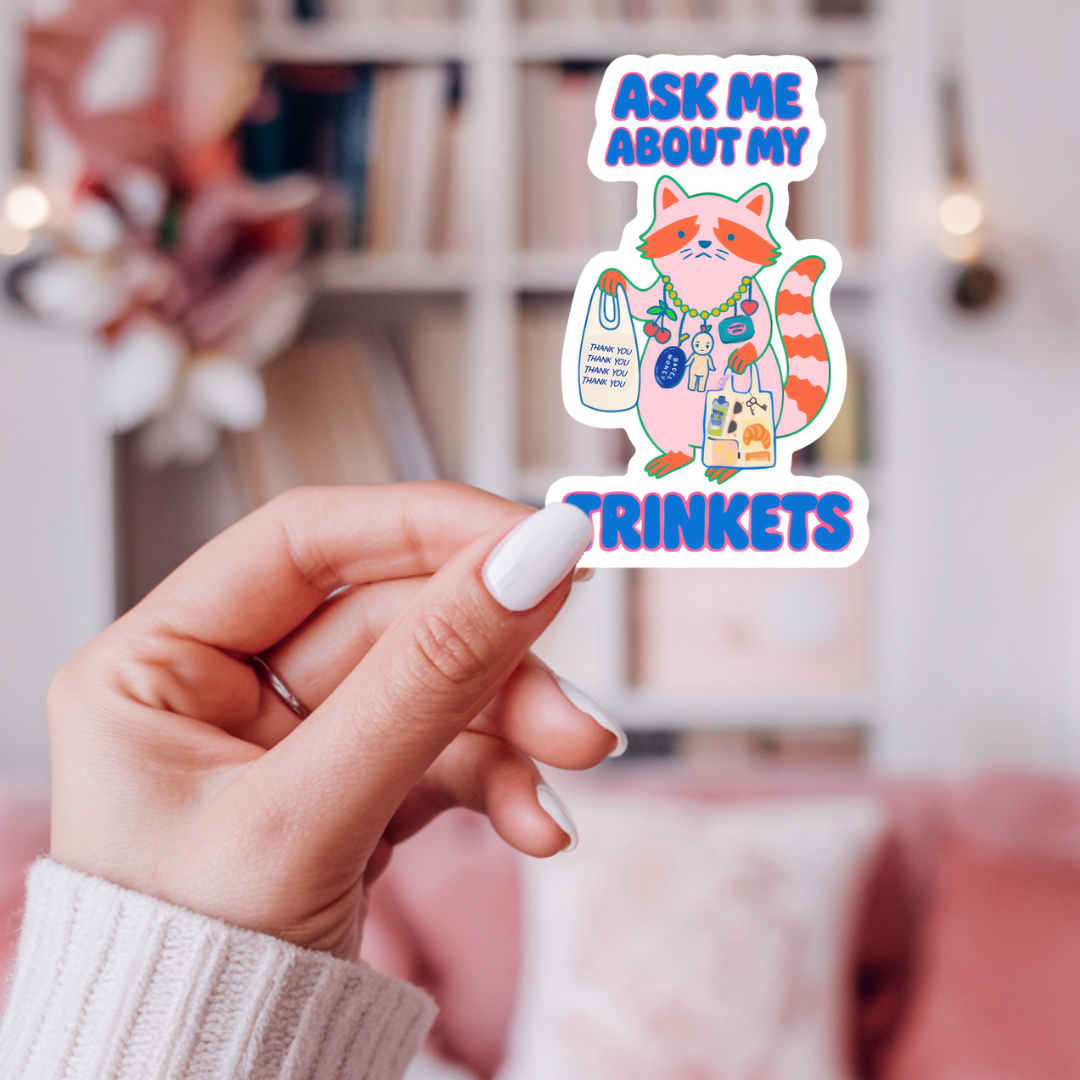 inviting affairs paperie - Ask Me About My Trinkets Sticker –Quirky Raccoon Collectible
